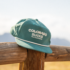 The Liar | Green Colorado Sucks Trucker Hat - Shinesty