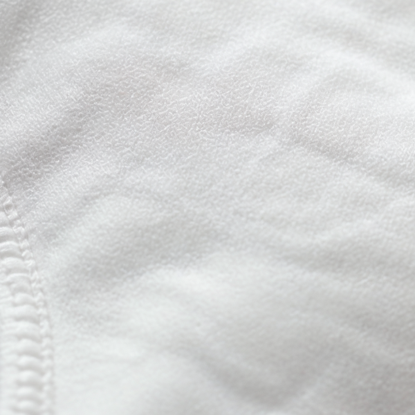 White cotton gusset liner sewn into Shinesty seamless underwear, stitch lines running across the frame